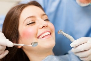 Woman getting teeth cleaned