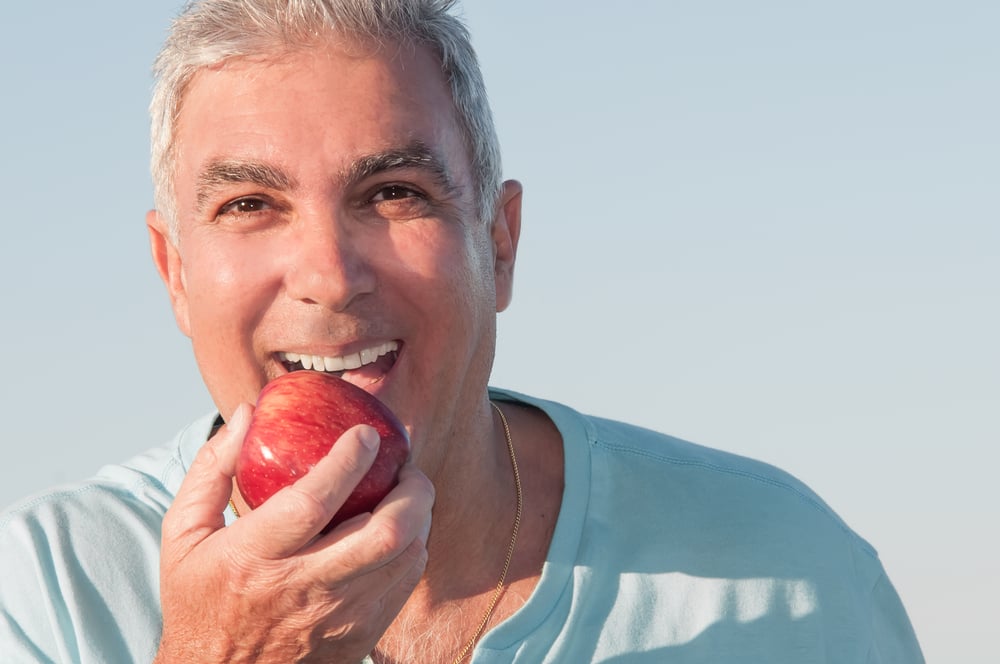 implant retained dentures can be a securely attached alternative to traditional dentures