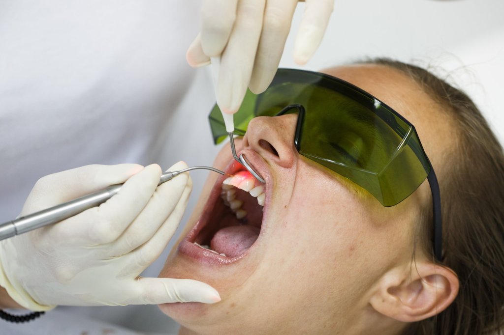 Dental patient with big green glasses on